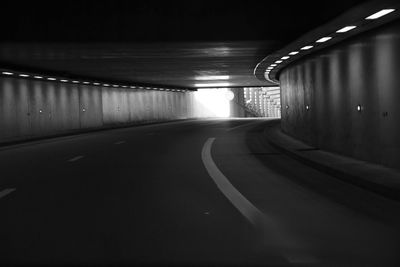 Illuminated tunnel at night