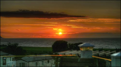 Scenic view of sea at sunset