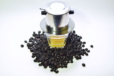 High angle view of coffee beans on white background