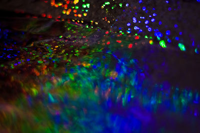 Defocused image of illuminated lights at night