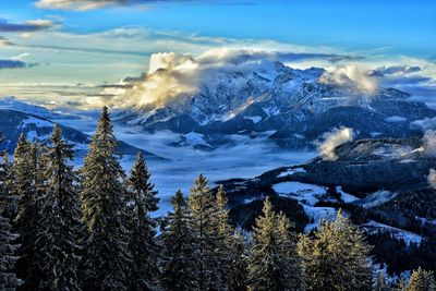 Scenic view of mountains against cloudy sky