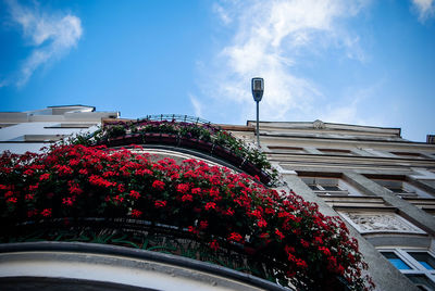 Low angle view of building against cloudy sky