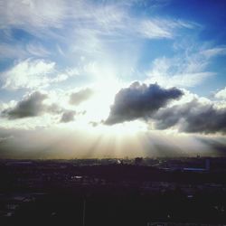 Scenic view of sunset over city