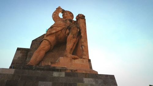 Low angle view of statue against clear sky