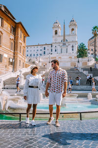 Full length of couple against historical building