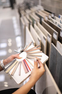 Cropped hands of woman holding book