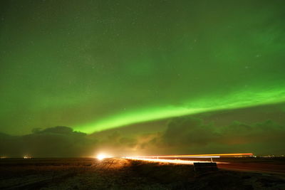 Scenic view of lake against sky at night