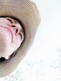 Close-up of young woman over white background