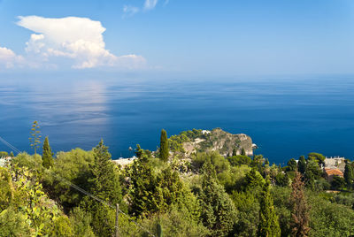 Scenic view of sea against blue sky