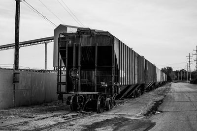 Train on railroad track against sky