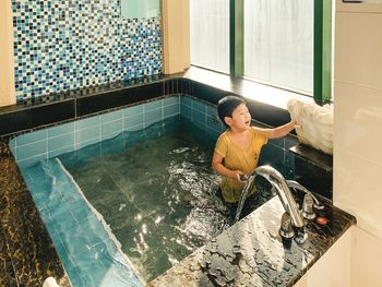 Low section of woman in swimming pool