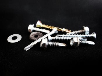 High angle view of piano keys on table against black background