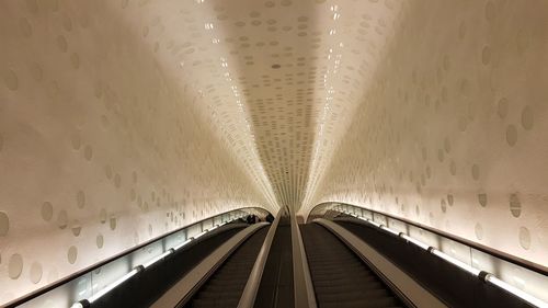 Low angle view of illuminated ceiling at subway station