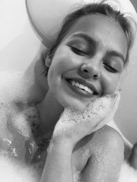 Portrait of smiling woman at home