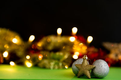 Close-up of illuminated christmas lights at night