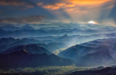 Scenic view of mountains against sky during sunset