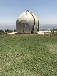 Tent on field against clear sky