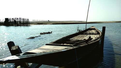Pier over sea against clear sky