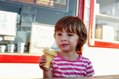 Girl holding ice cream cone