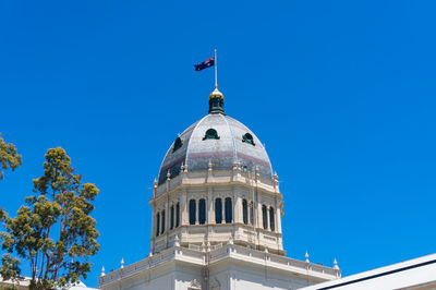 Low angle view of building against clear blue sky