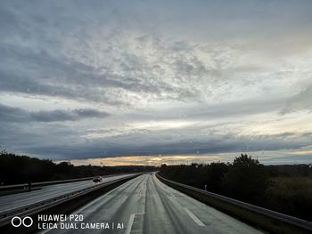 Highway against sky during sunset