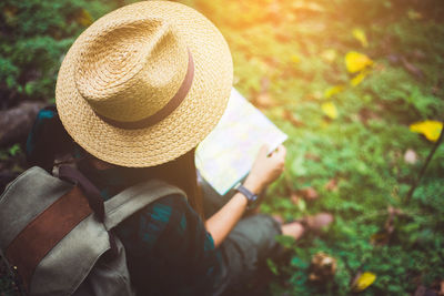 Rear view of person wearing hat