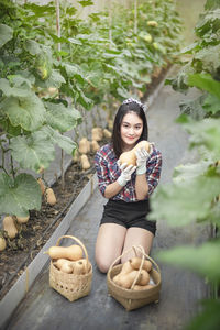 Portrait of young woman sitting outdoors