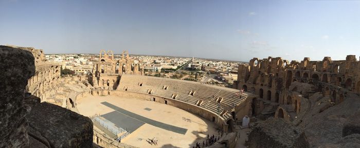 Panoramic view of colosseum against sky