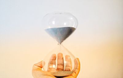 Close-up of person holding balloons