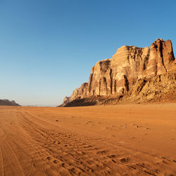 Scenic view of desert against clear sky