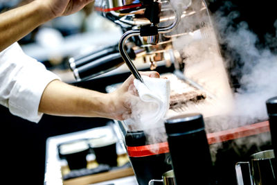 Close-up barista cleaning