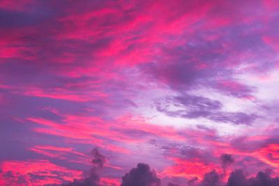 Low angle view of dramatic sky during sunset