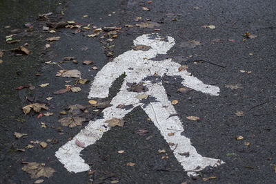 High angle view of arrow sign on road