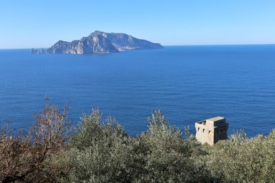 Scenic view of sea against clear blue sky