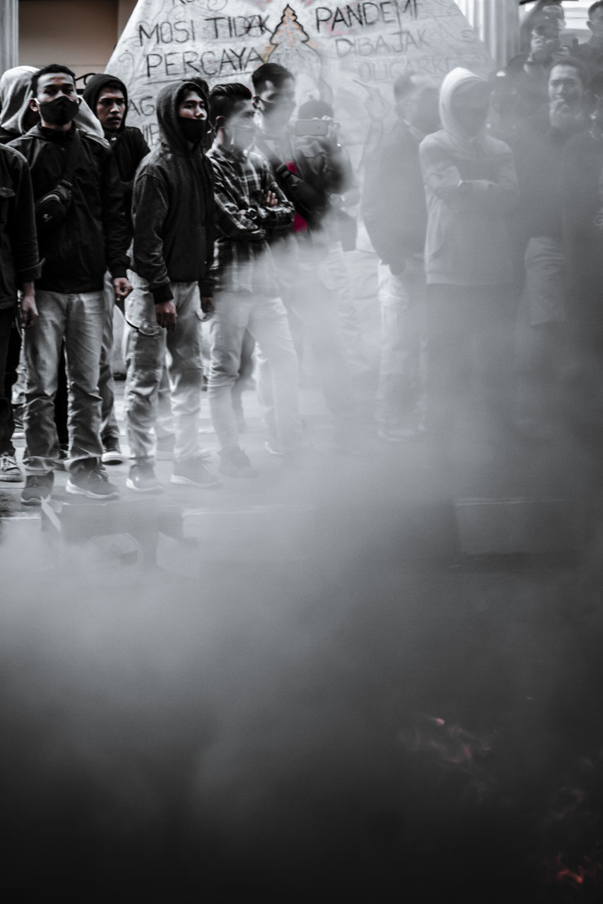 GROUP OF PEOPLE WALKING IN CITY