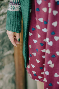 Midsection of woman wearing sweater