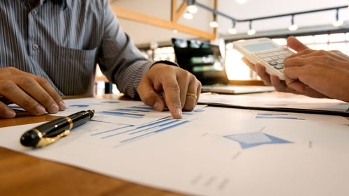 Close-up of man working on table
