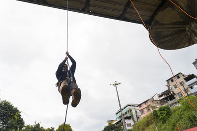 Rappelist man going up the walkway on the rappel rope. 