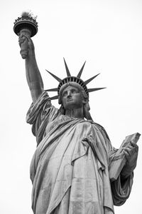 Low angle view of statue of liberty  against clear sky