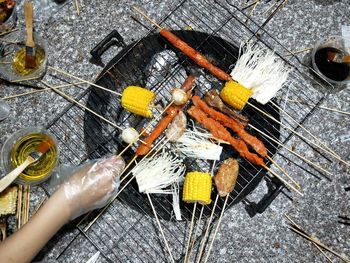 High angle view of meat on barbecue grill