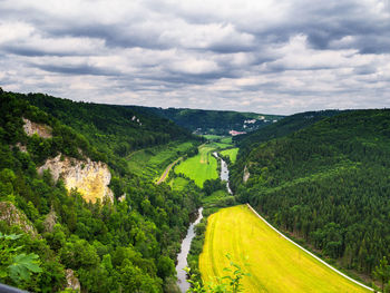 High angle view of river against cloudy sky