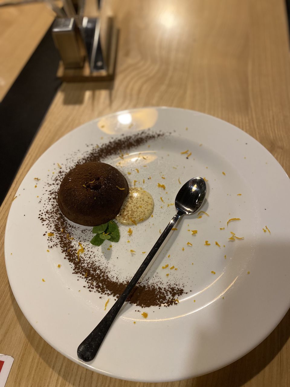 food, food and drink, plate, table, sweet food, indoors, eating utensil, sweet, dessert, kitchen utensil, freshness, no people, cake, fork, high angle view, chocolate, meal, baked, wood, icing, unhealthy eating