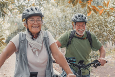 Portrait of senior man riding bicycle