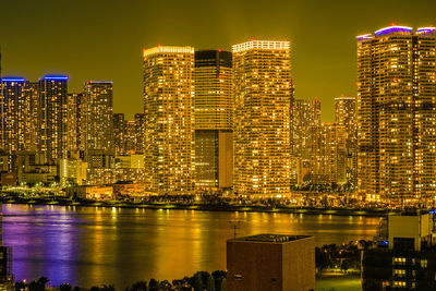 Illuminated buildings in city at night