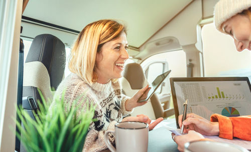 Businesswomen telecommuting in motor home