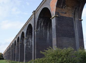 Arch bridge against sky