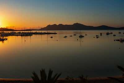 Scenic view of lake against sky during sunset