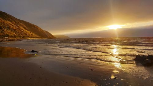 Scenic view of sea against sky during sunset