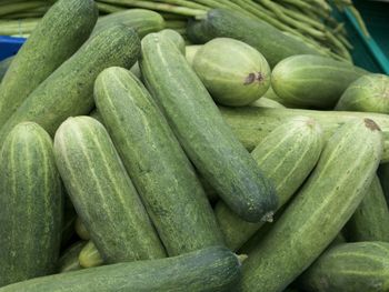 Close-up of zucchinis for sale at market