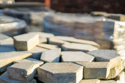 High angle view of cobblestones on a orderly pile under sunset light